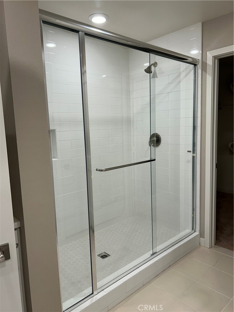 202 Tribeca Irvine, CA 92612 - Photo 8 of 21 a bathroom with a glass shower door