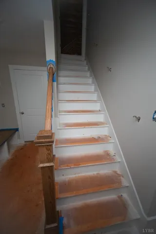 a view of stairs with an empty room