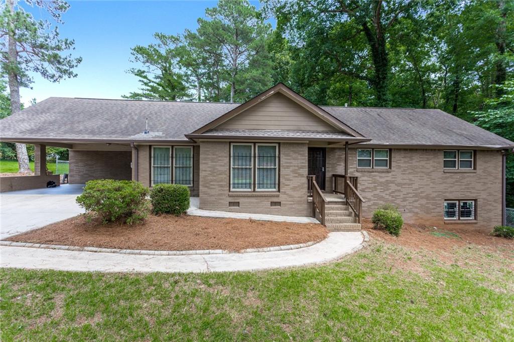 2760 Kelley Chapel Road Decatur, GA 30034 - Photo 1 of 1 a view of a house with a yard and sitting area