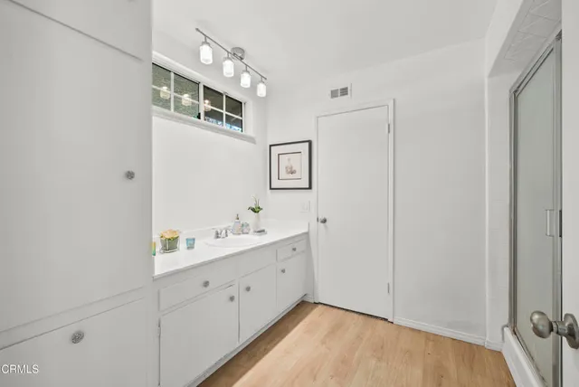 a view of bathroom with dual sinks