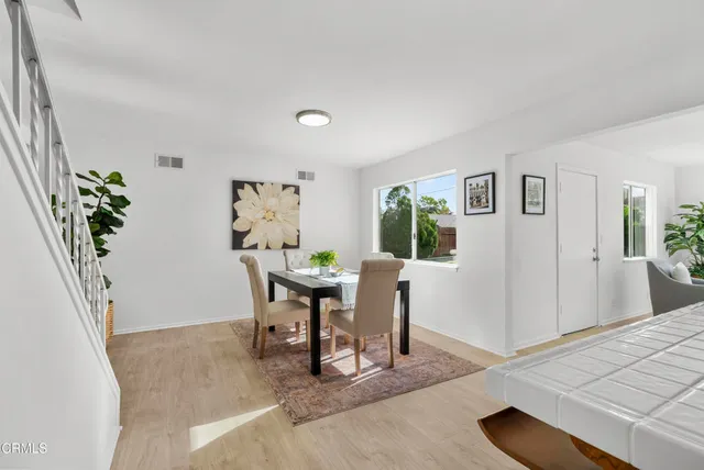 a view of a livingroom with furniture and a window