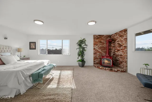 a bedroom with bed and a couch