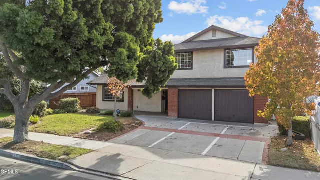 an aerial view of houses with outdoor space
