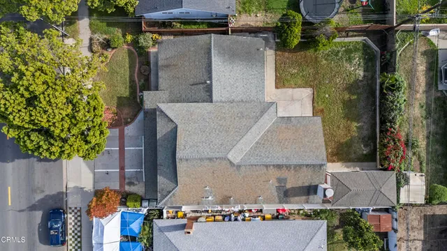 an aerial view of residential house with outdoor space