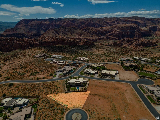 Basalt Cir Street, Unit 1027 St. George, UT 84770 - Photo 20 of 29 Aerial view of residential area with a mountain backdrop