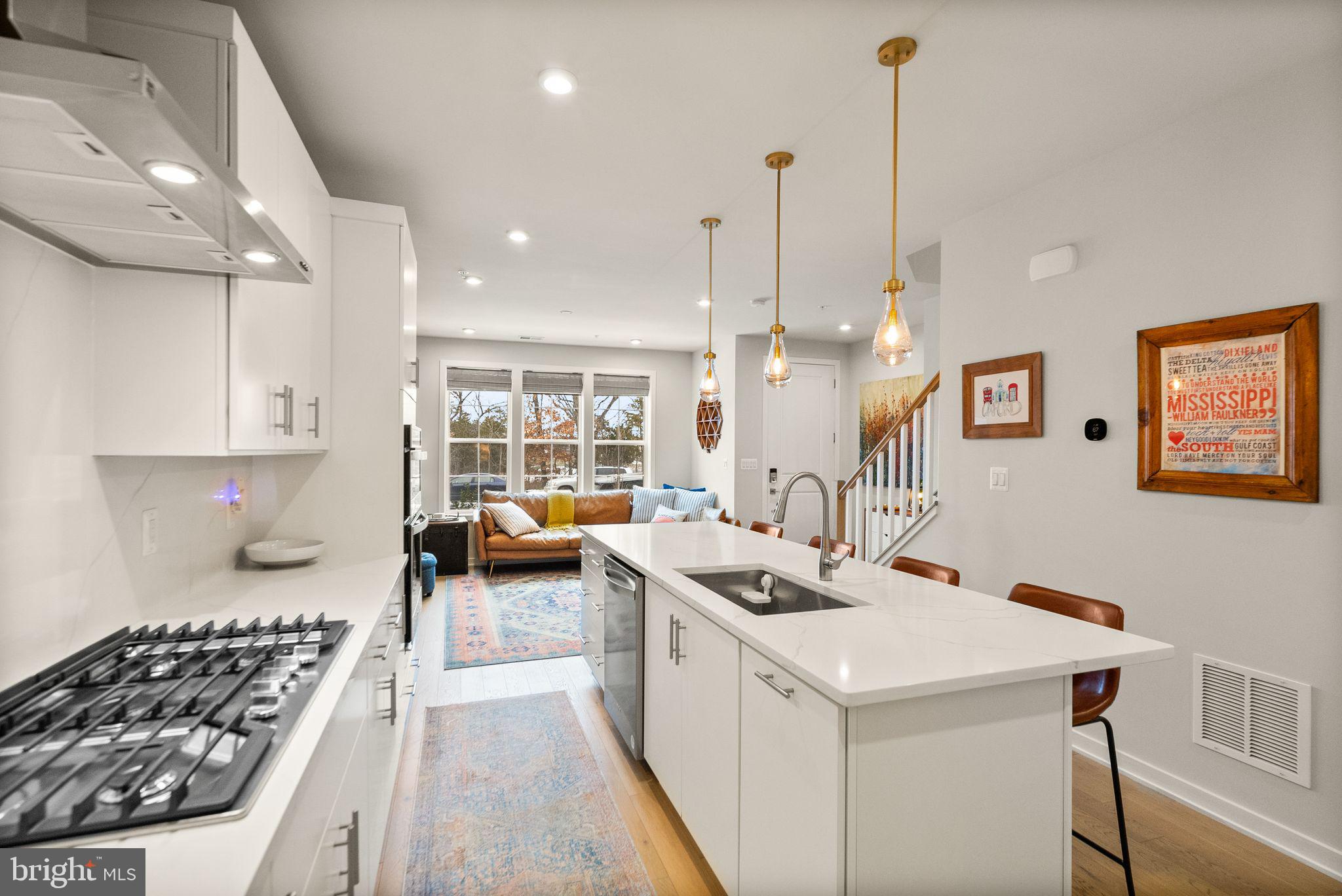 43553 Charitable Street Ashburn, VA 20148 - Photo 14 of 63 a kitchen that has a lot of appliances and cabinets