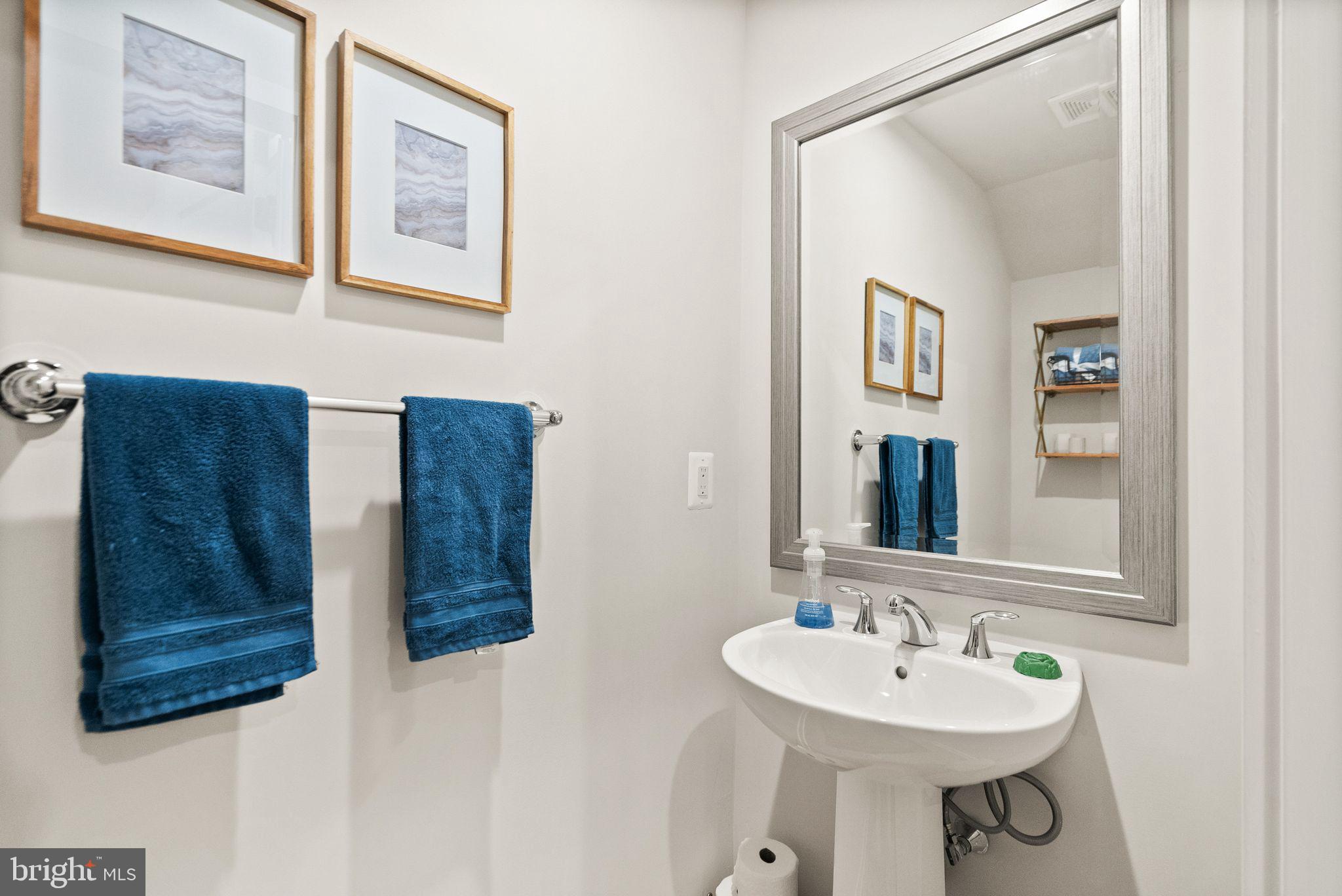 43553 Charitable Street Ashburn, VA 20148 - Photo 21 of 63 a bathroom with double vanity sinks and a mirror