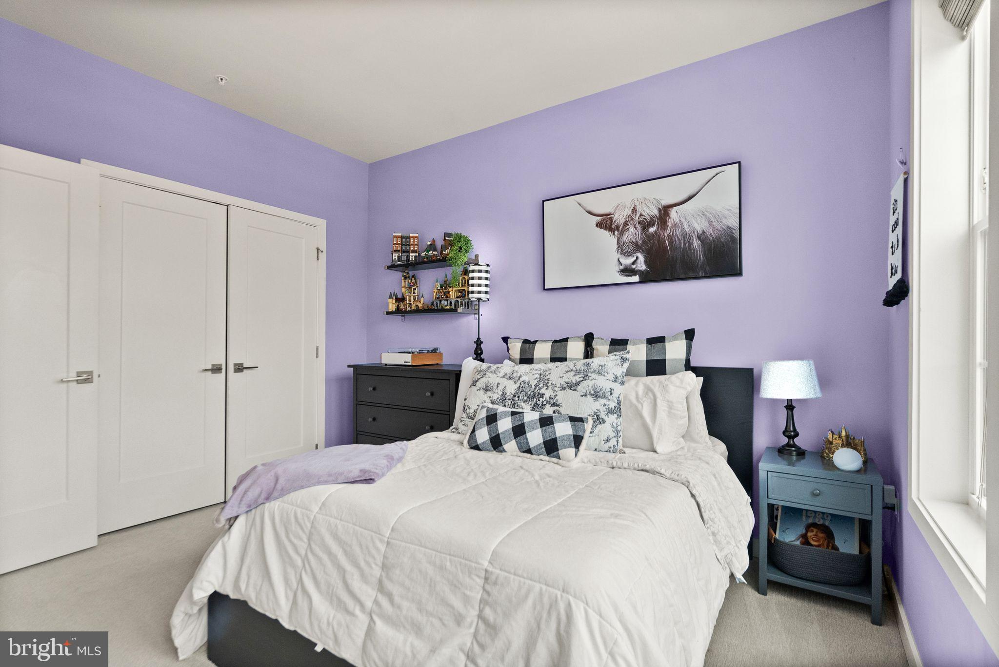43553 Charitable Street Ashburn, VA 20148 - Photo 43 of 63 a bedroom with a bed and a painting on the wall