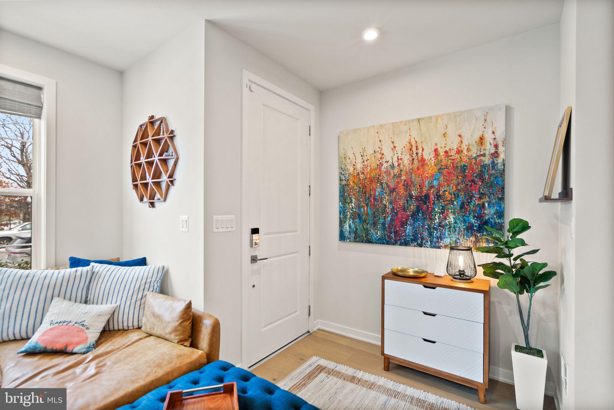 43553 Charitable Street Ashburn, VA 20148 - Photo 8 of 63 a bedroom with a bed and a dresser in it