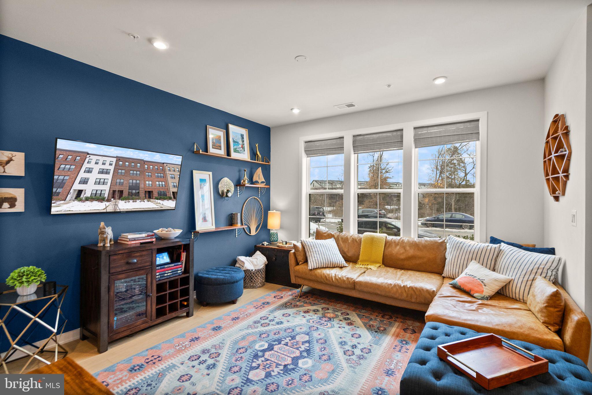 43553 Charitable Street Ashburn, VA 20148 - Photo 9 of 63 a living room with furniture and a flat screen tv