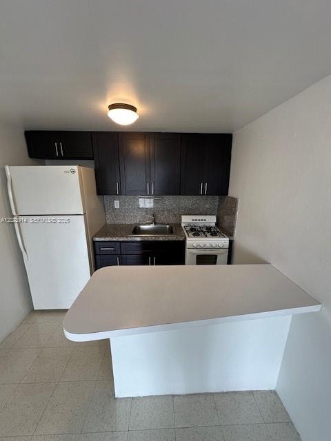 1400 Douglas Road, Unit 17 Coral Gables, FL 33134 - Photo 7 of 16 a kitchen with a table and chairs