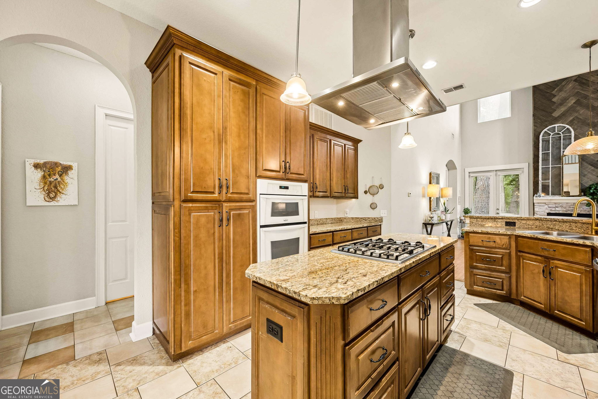 706 Hopewell Point Road White Oak, GA 31568 - Photo 20 of 84 Double wall ovens, extensive cabinetry, and a spacious island make meal preparation and entertaining effortless in this thoughtfully designed kitchen.