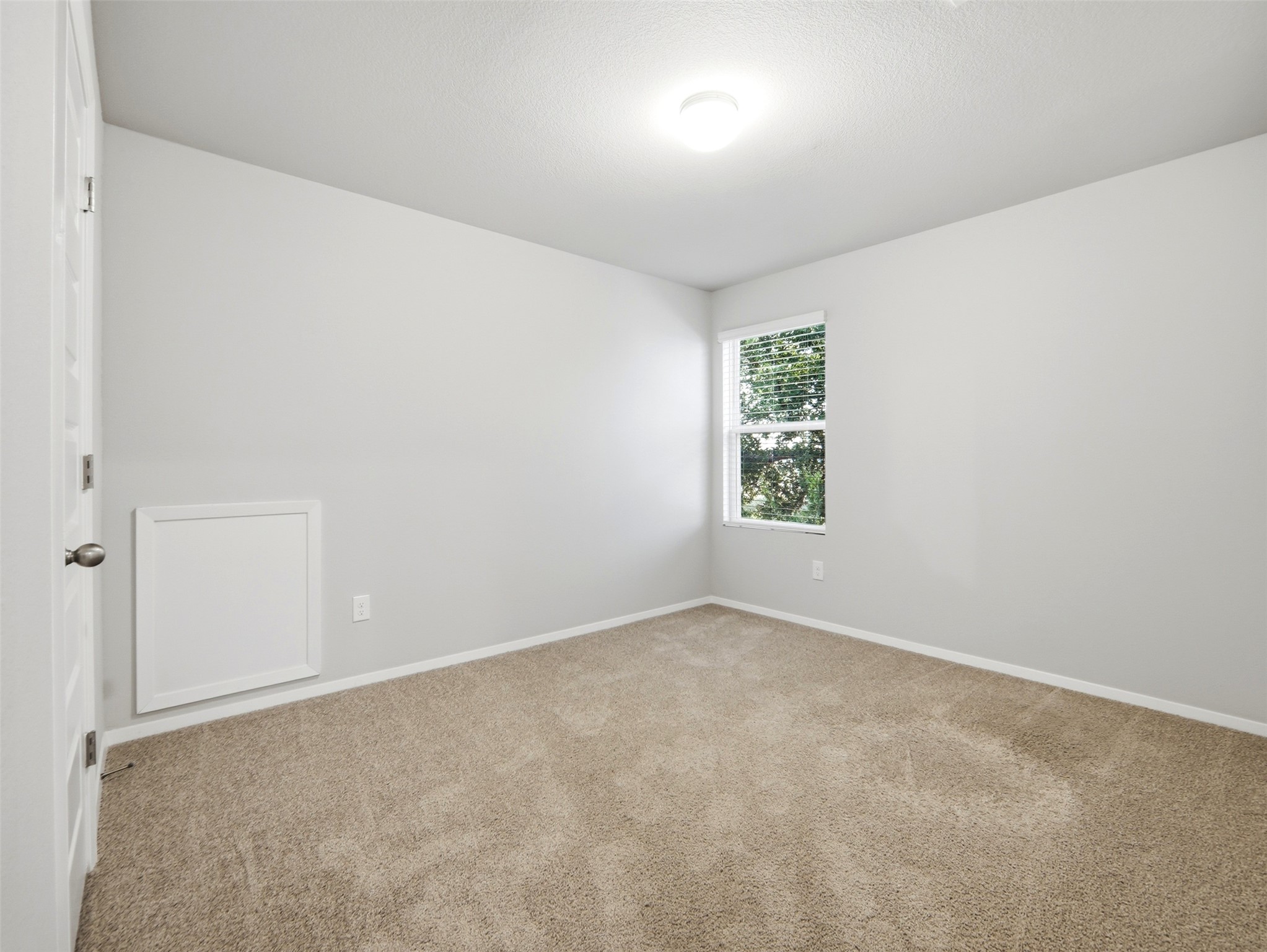 60 Bent Trl Lane Georgetown, TX 78628 - Photo 22 of 40 A well-lit bedroom with neutral carpet and ample natural light invites relaxation.