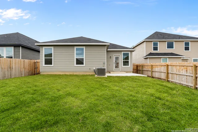 a backyard of a house with lots of green space