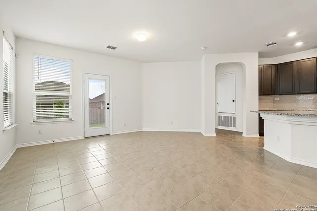 a view of a kitchen with a sink and a stove top oven