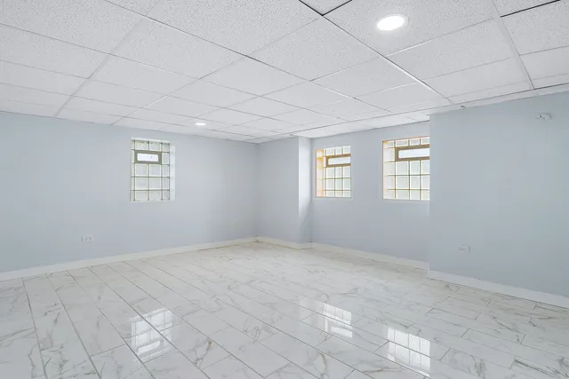 a view of an empty room with windows