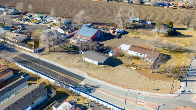 an aerial view of residential houses with outdoor space