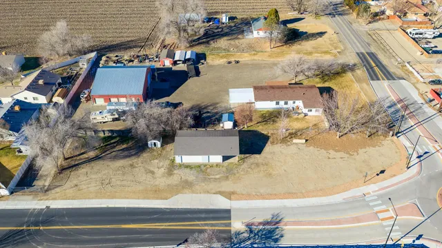 an aerial view of a house with a swimming pool