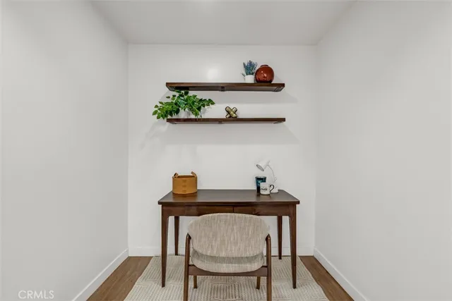 a kitchen with wooden cabinets a sink a window and stainless steel appliances