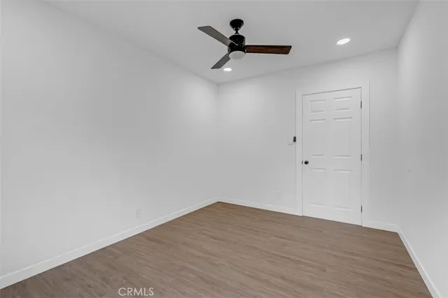 a kitchen with white cabinets
