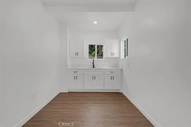 a white stove top oven sitting inside of a kitchen