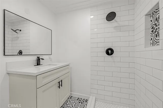 an aerial view of a house with a yard and lake view