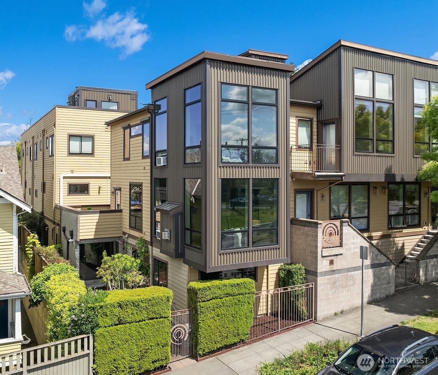 3818 South Hudson Street, Unit A Seattle, WA 98118 - Photo 2 of 31 a front view of a multi story residential apartment building