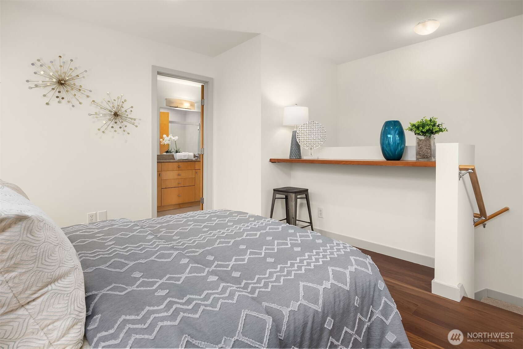 3818 South Hudson Street, Unit A Seattle, WA 98118 - Photo 21 of 31 a bedroom with a bed and painting on the wall