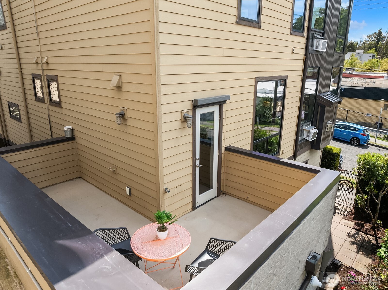3818 South Hudson Street, Unit A Seattle, WA 98118 - Photo 25 of 31 a view of a patio with table and chairs and potted plants