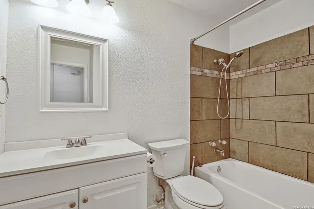 a view of a wooden house with a yard