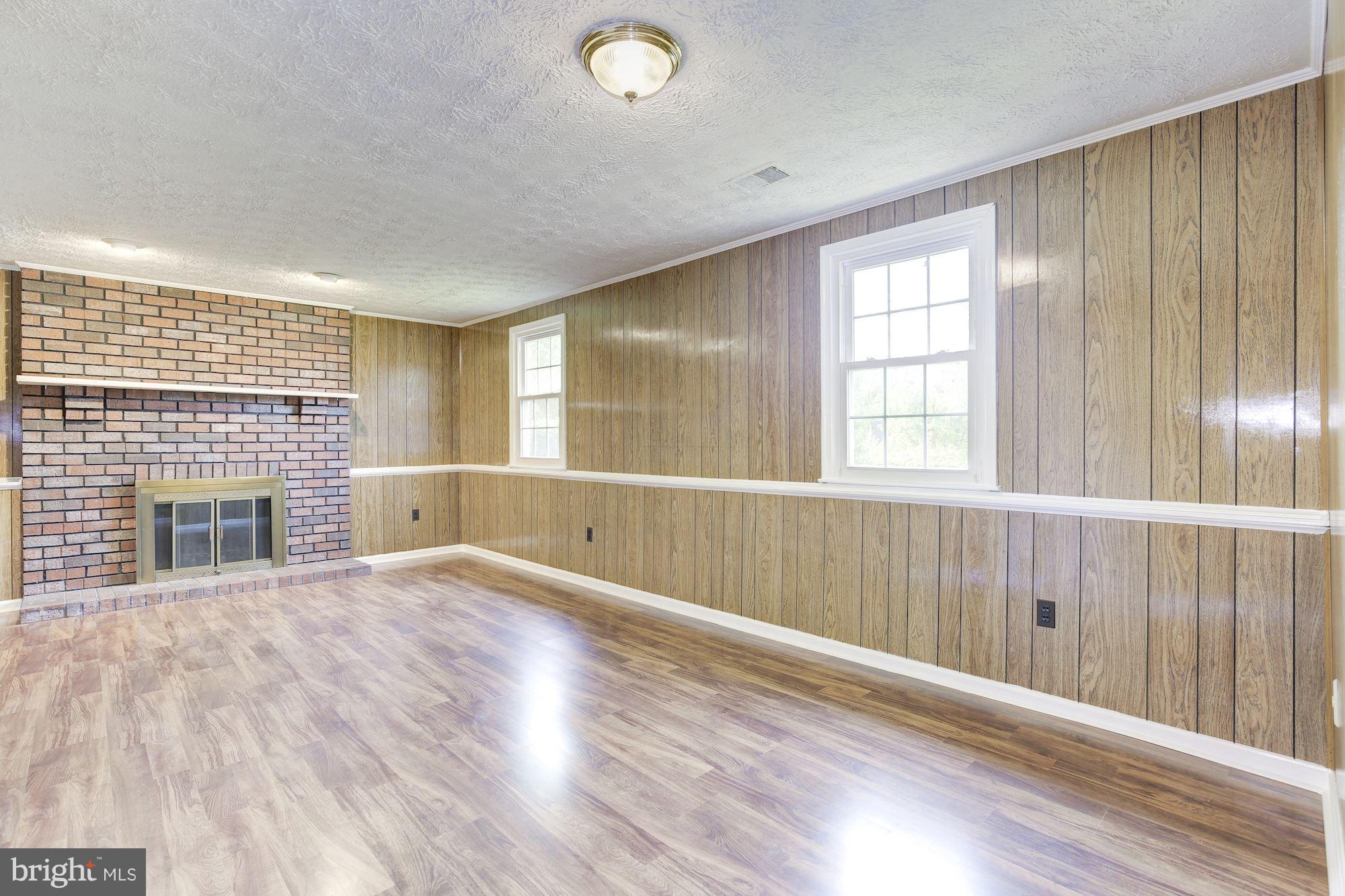 11501 Clopper Road Gaithersburg, MD 20878 - Photo 25 of 30 Family room with fireplace