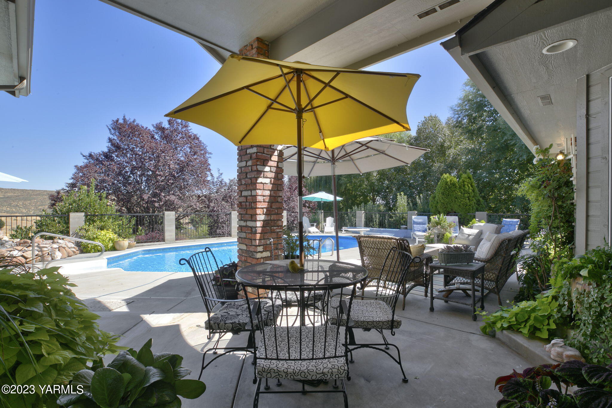 11521 Marble Extension Yakima, WA 98908 - Photo 26 of 40 a view of backyard with seating space and trees