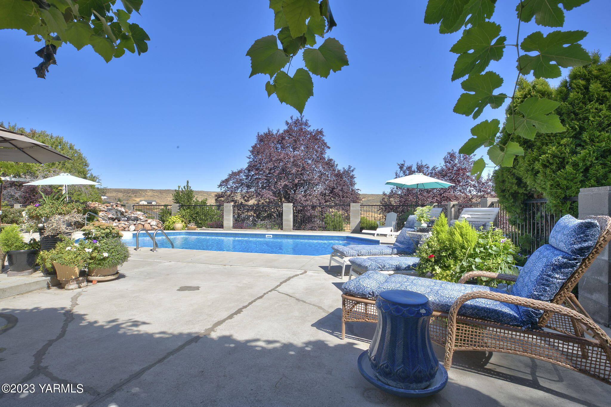 11521 Marble Extension Yakima, WA 98908 - Photo 31 of 40 a picture of table and chairs and potted plants