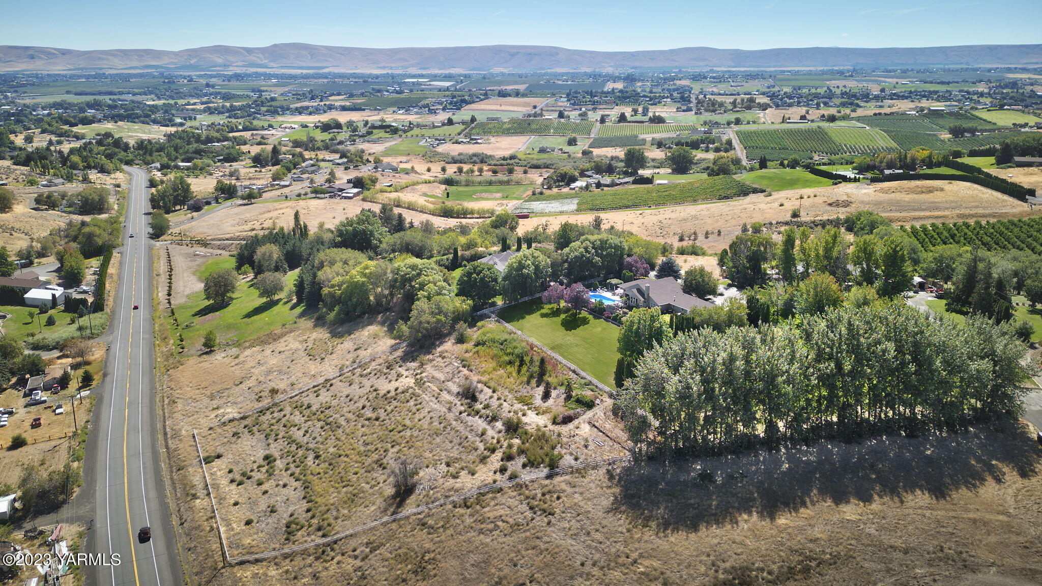 11521 Marble Extension Yakima, WA 98908 - Photo 39 of 40 a view of a lake with mountains in the background