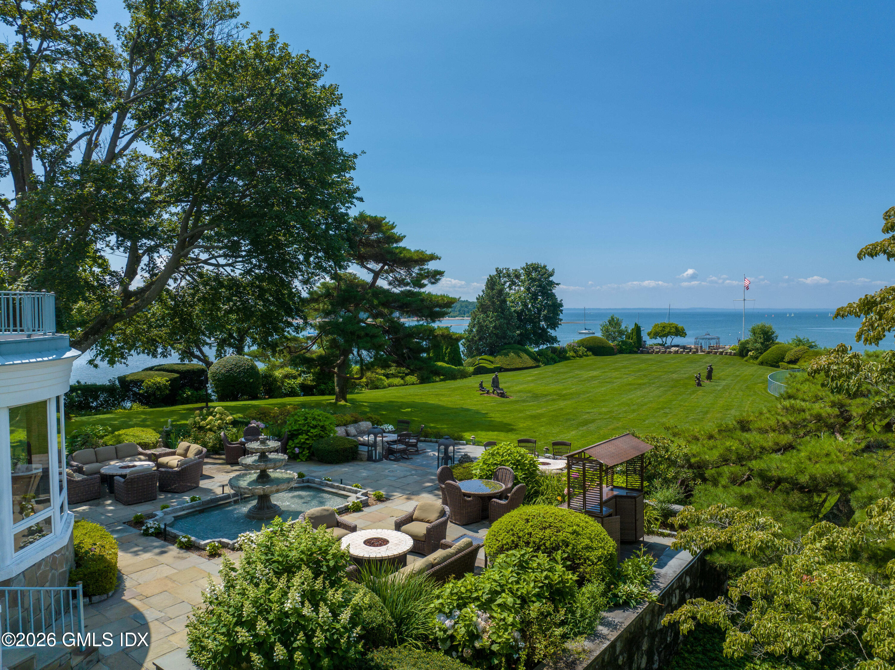 108 Cedar Cliff Road Riverside, CT 06878 - Photo 34 of 49 a view of a garden with plants and large trees