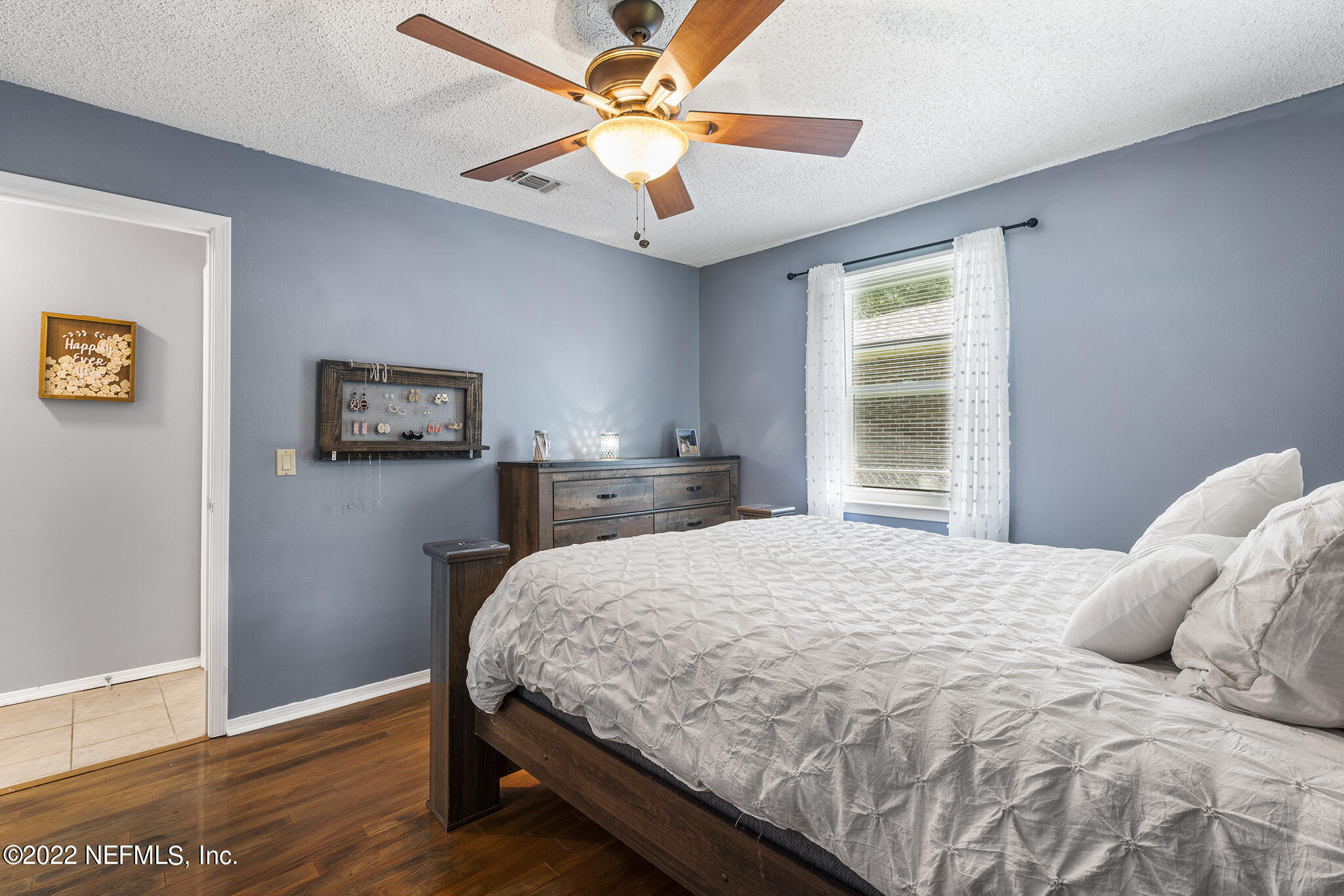 648 West Oliver Street Baldwin, FL 32234 - Photo 19 of 30 a bedroom with a bed and a window