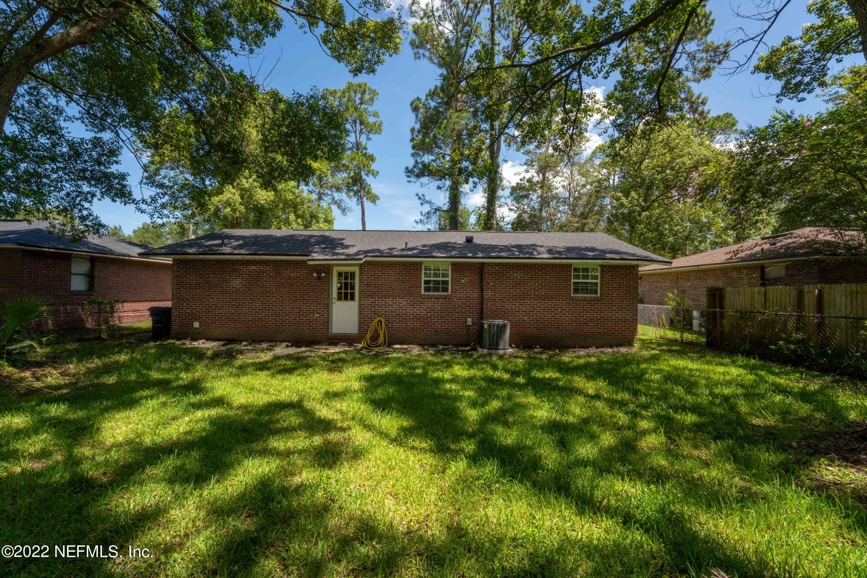 648 West Oliver Street Baldwin, FL 32234 - Photo 24 of 30 a view of backyard with green space