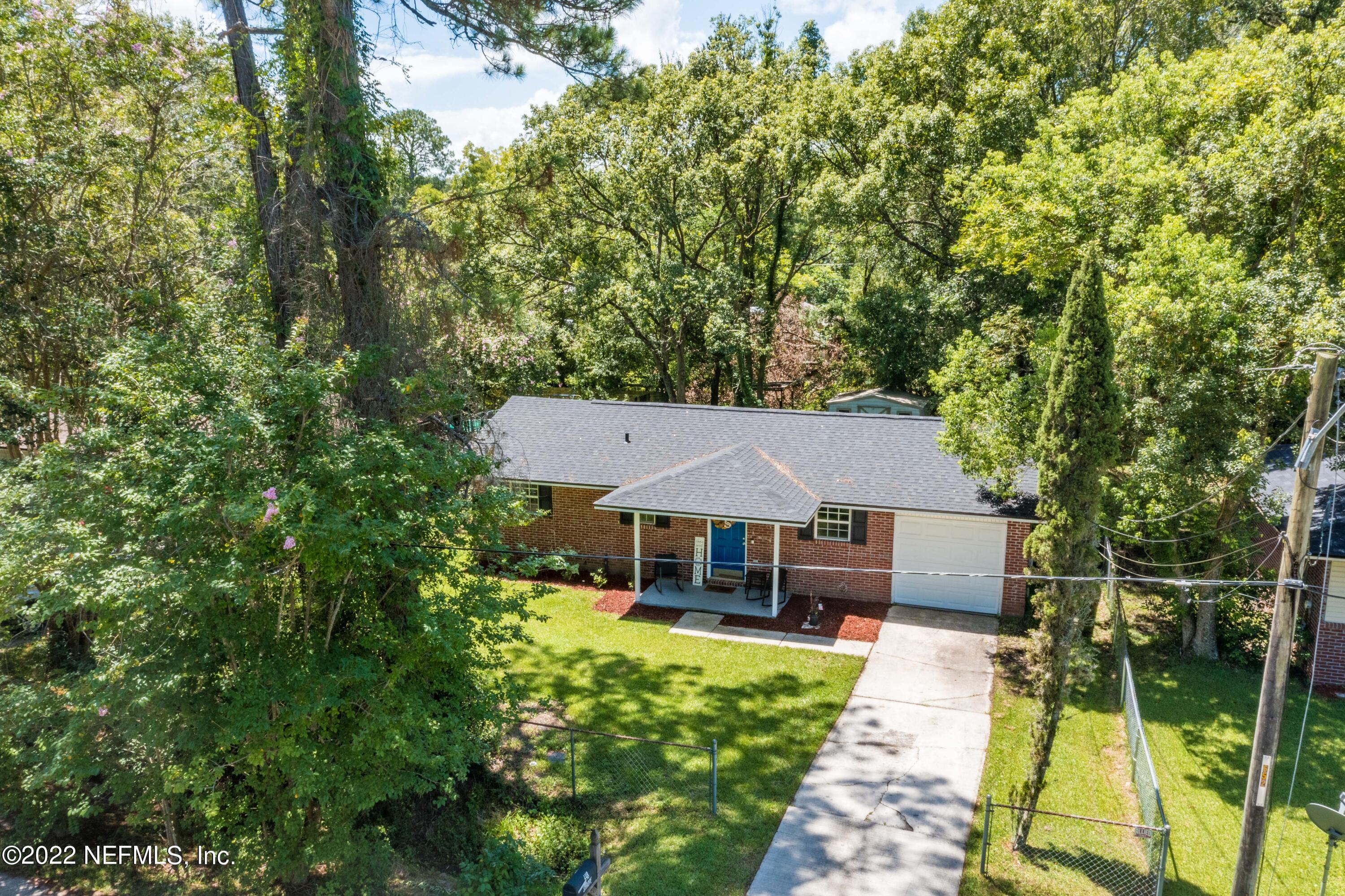 648 West Oliver Street Baldwin, FL 32234 - Photo 28 of 30 a front view of a house with a yard