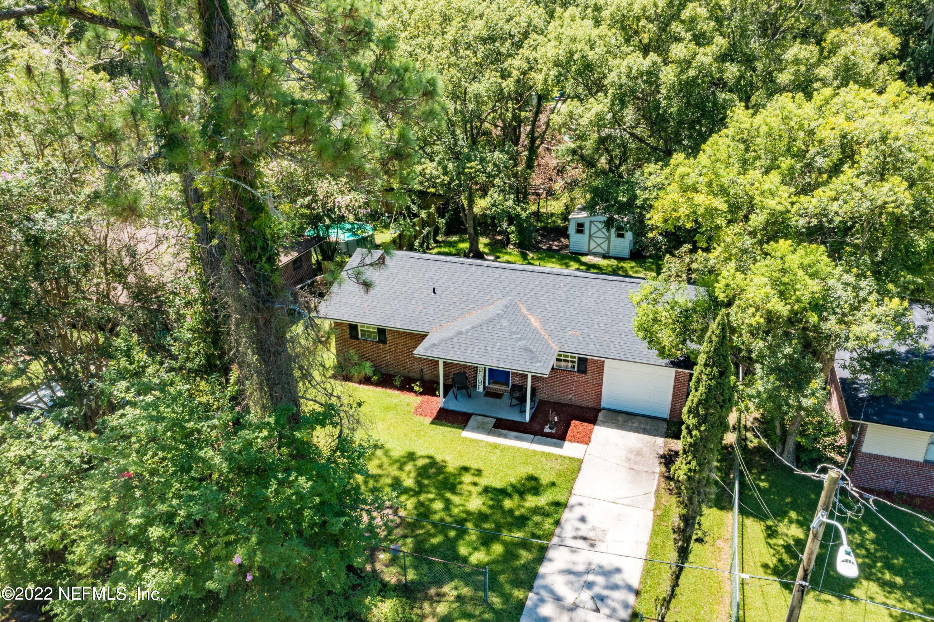 648 West Oliver Street Baldwin, FL 32234 - Photo 29 of 30 an aerial view of a house with swimming pool garden and patio
