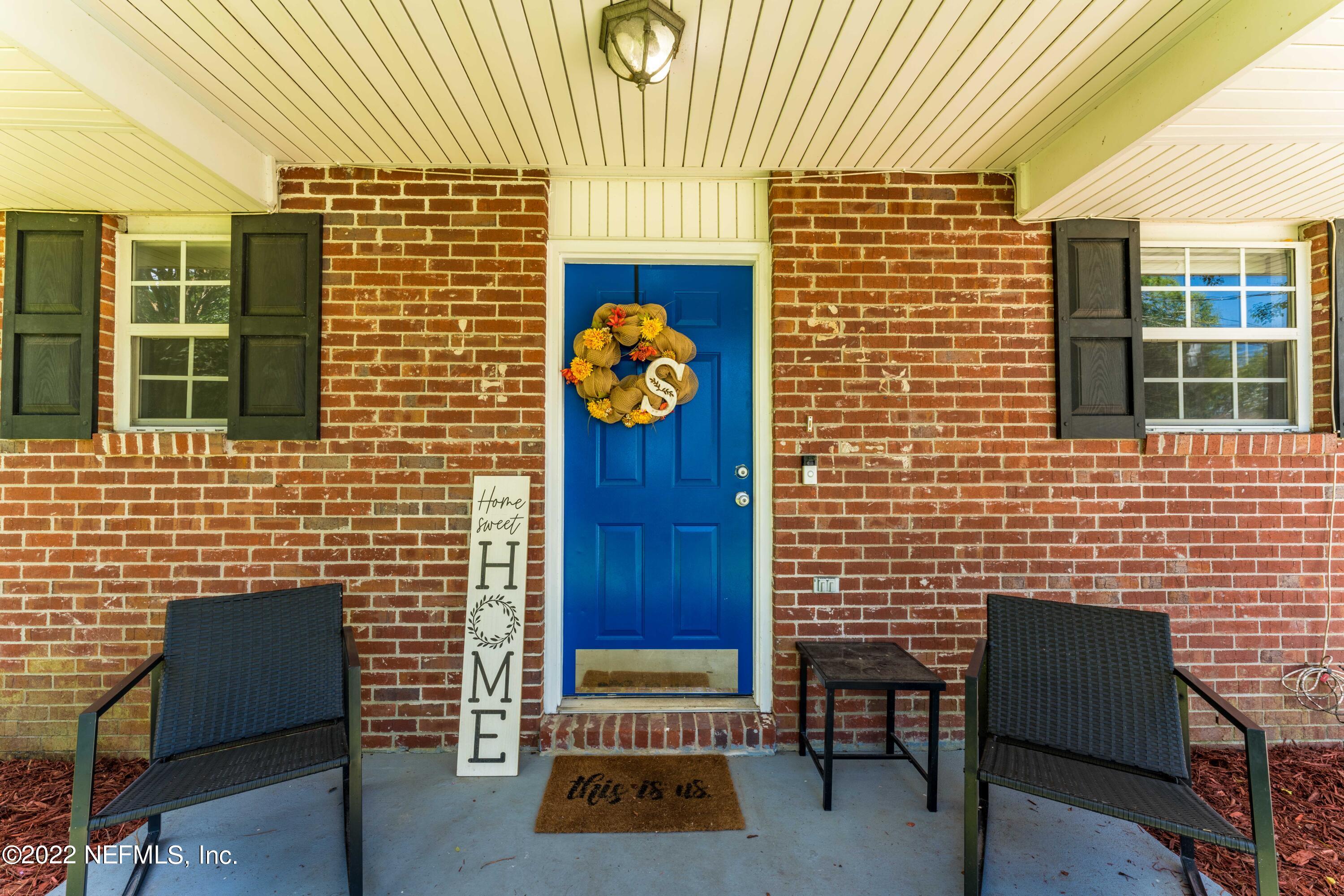 648 West Oliver Street Baldwin, FL 32234 - Photo 3 of 30 a brick building with a door