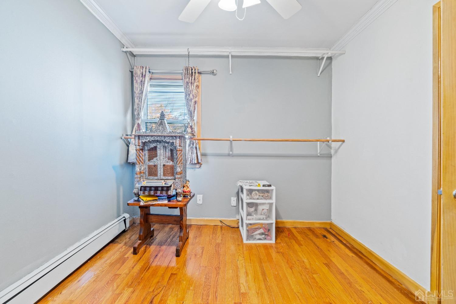 185 Midfield Road Colonia, NJ 07067 - Photo 11 of 27 a view of a room with wooden floor and lounge chair