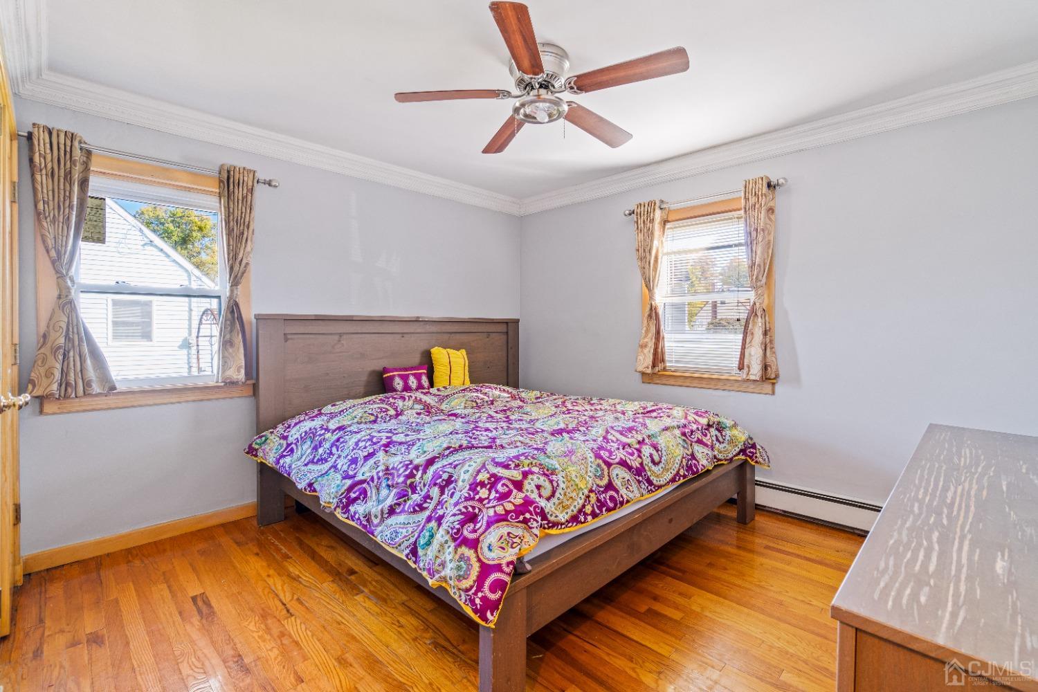 185 Midfield Road Colonia, NJ 07067 - Photo 12 of 27 a bedroom with a bed and a window