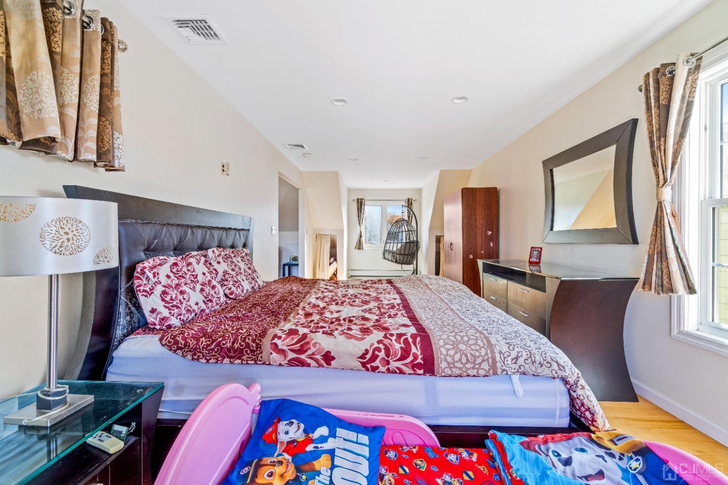 185 Midfield Road Colonia, NJ 07067 - Photo 16 of 27 a bedroom with a bed and wooden floor