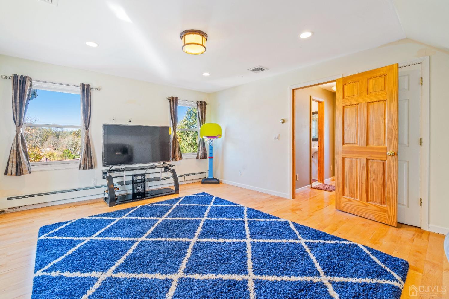 185 Midfield Road Colonia, NJ 07067 - Photo 17 of 27 a bedroom with a bed and a window