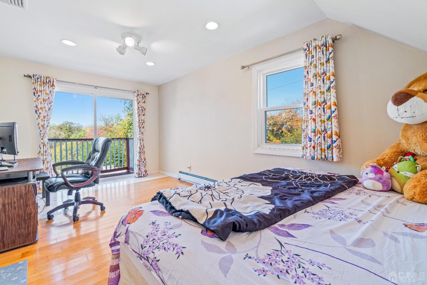 185 Midfield Road Colonia, NJ 07067 - Photo 18 of 27 a bedroom with a bed and wooden floor