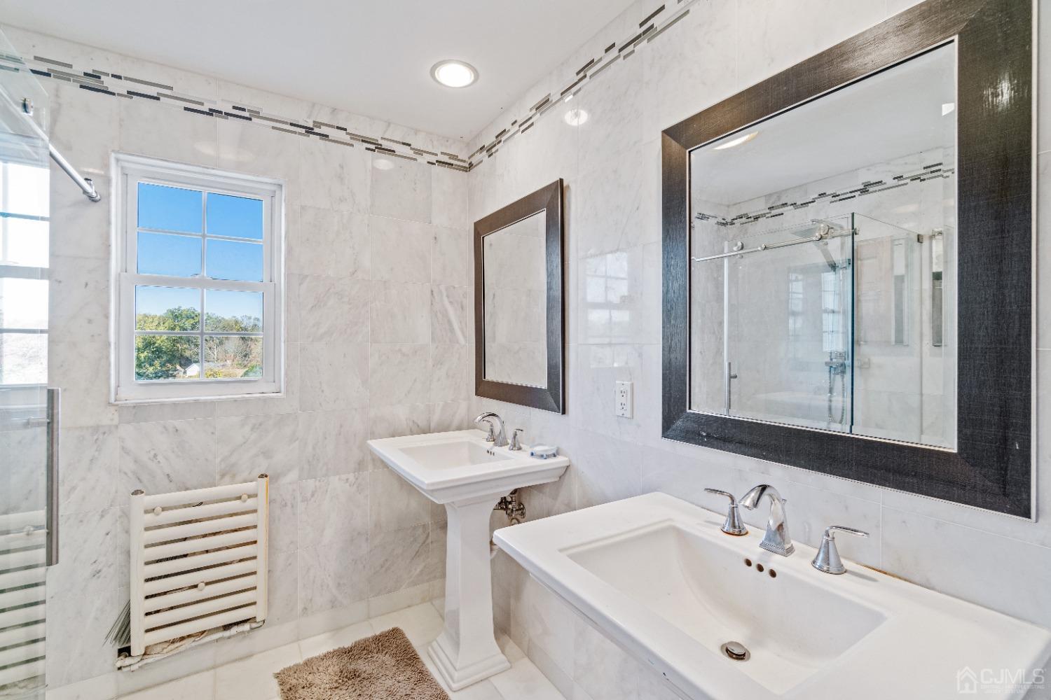 185 Midfield Road Colonia, NJ 07067 - Photo 19 of 27 a bathroom with a sink and a mirror