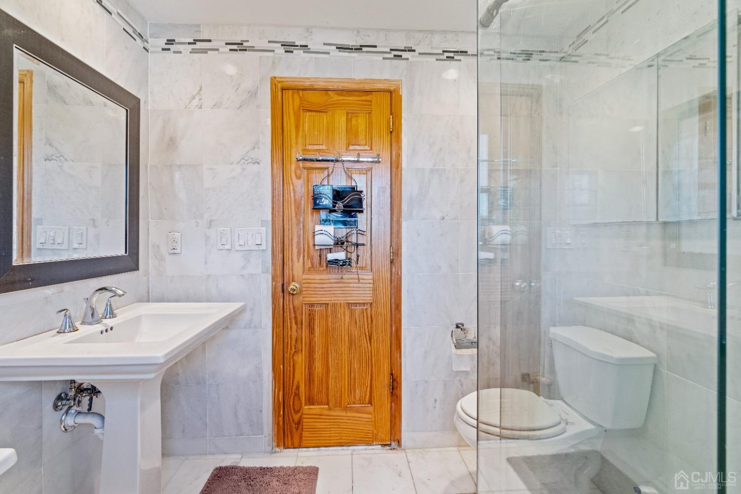 185 Midfield Road Colonia, NJ 07067 - Photo 20 of 27 a bathroom with a sink toilet and shower
