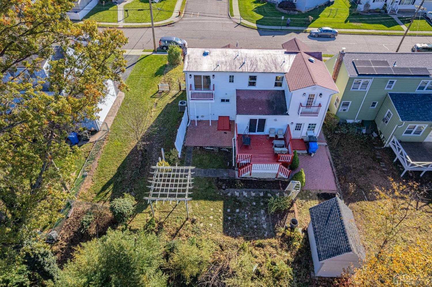 185 Midfield Road Colonia, NJ 07067 - Photo 2 of 27 an aerial view of residential houses with outdoor space
