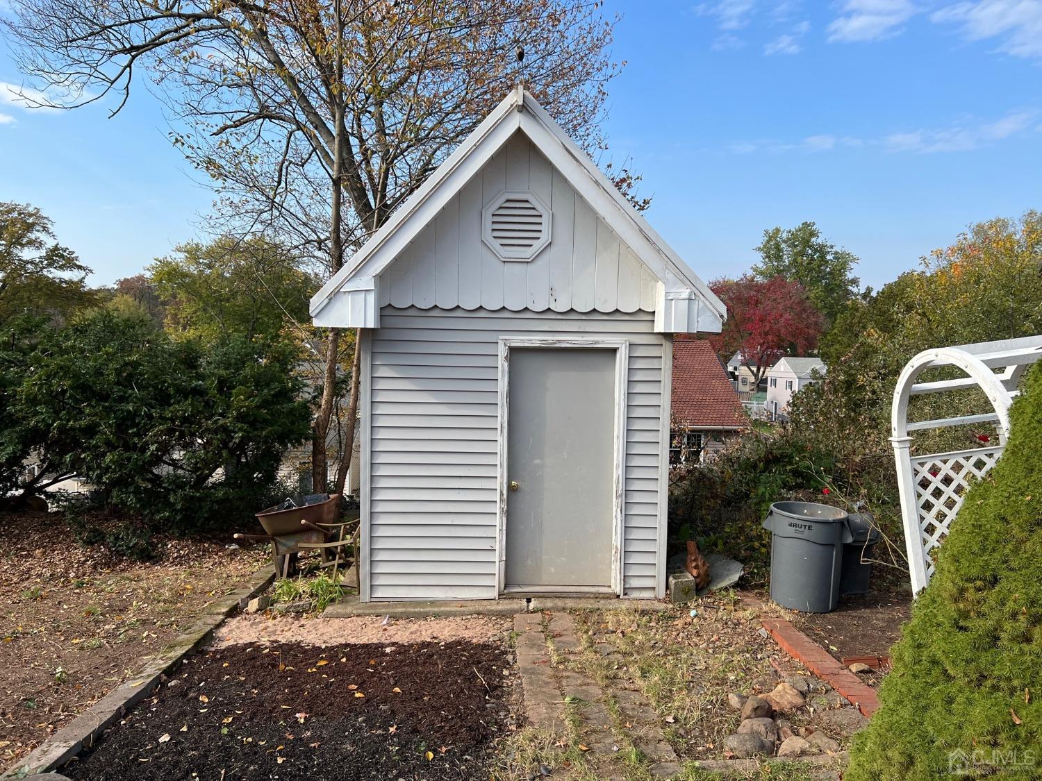185 Midfield Road Colonia, NJ 07067 - Photo 27 of 27 a front view of a house with garden