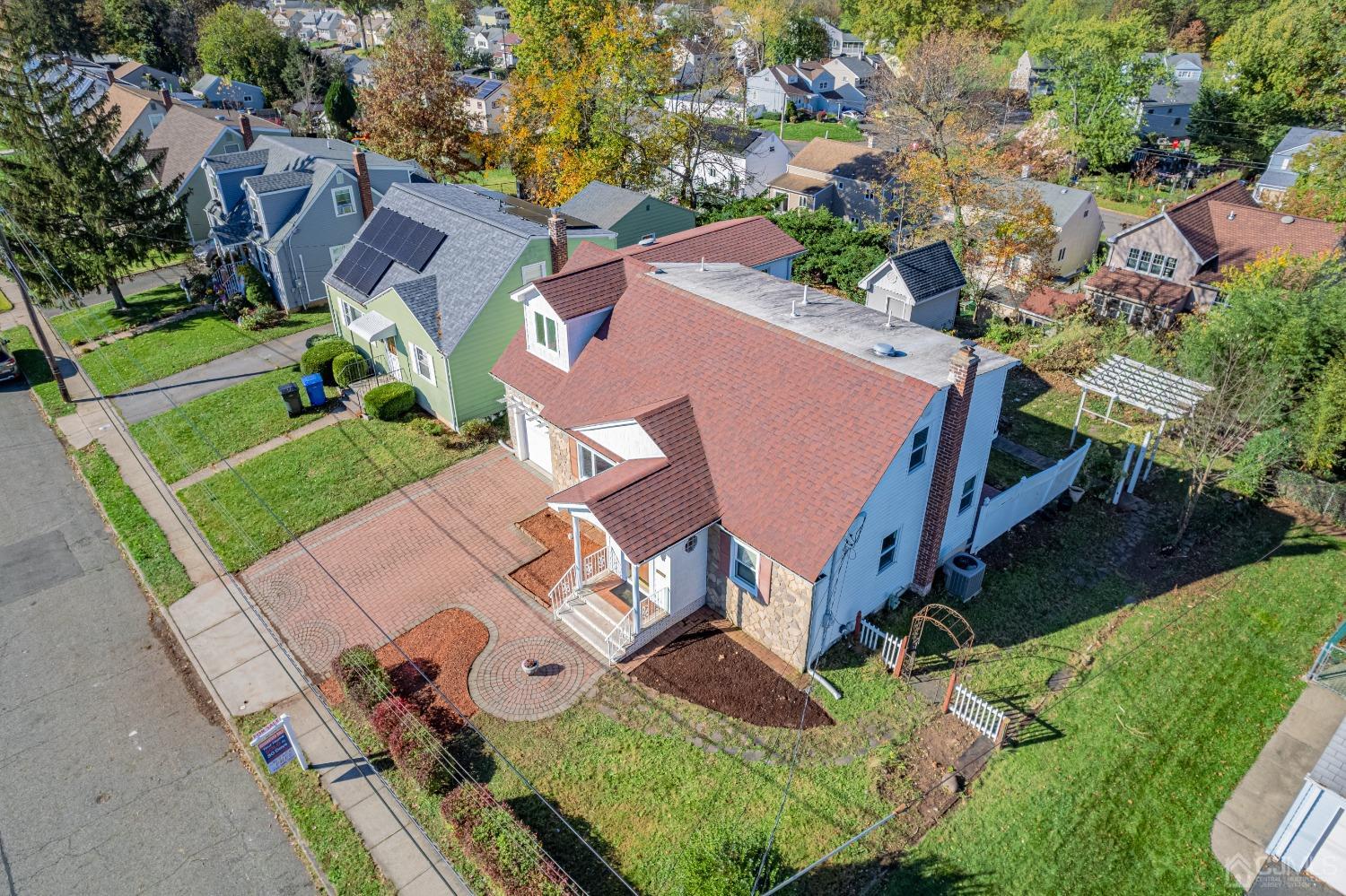 185 Midfield Road Colonia, NJ 07067 - Photo 3 of 27 an aerial view of a house with a yard and lake